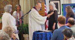 Rev. Bill Whitley ordains Rev. Trish as a minister.